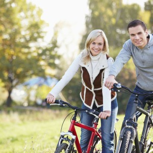 Happy couple riding bikes