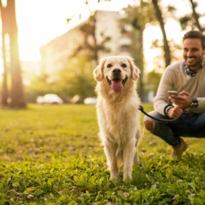 man with dog on leash