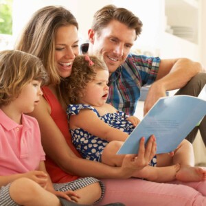 family reading a book together